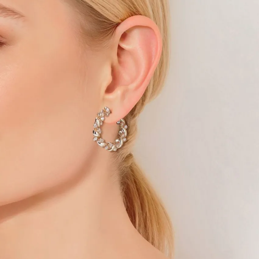 Manfield Gouden gedraaide oorbellen met roze glaskralen^ Sieraden