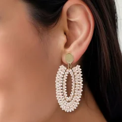 Manfield Roze kralen oorbellen met goudkleurige details^ Sieraden